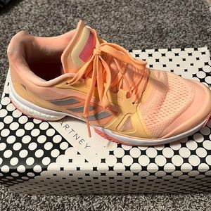 Orange tennis Stella court sneakers.